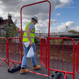 Person walking through a Crossing Point with gate, demonstrating access and usage